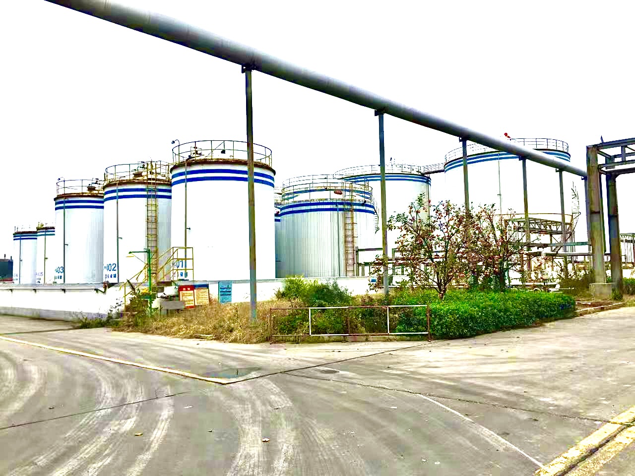 Chemical storage tanks and factory pipeline area from the company presentation